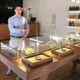 Pat Doherty, director of new market development for Acreage Holdings, describes products inside a display case at The Botanist in Fargo, N.D., Thursday, Feb. 28, 2019. The business located in a south-side mini-mall is North Dakota's first medical marijuana dispensary. North Dakota voters approved the drug in November 2016, after lawmakers refused to do it. ()